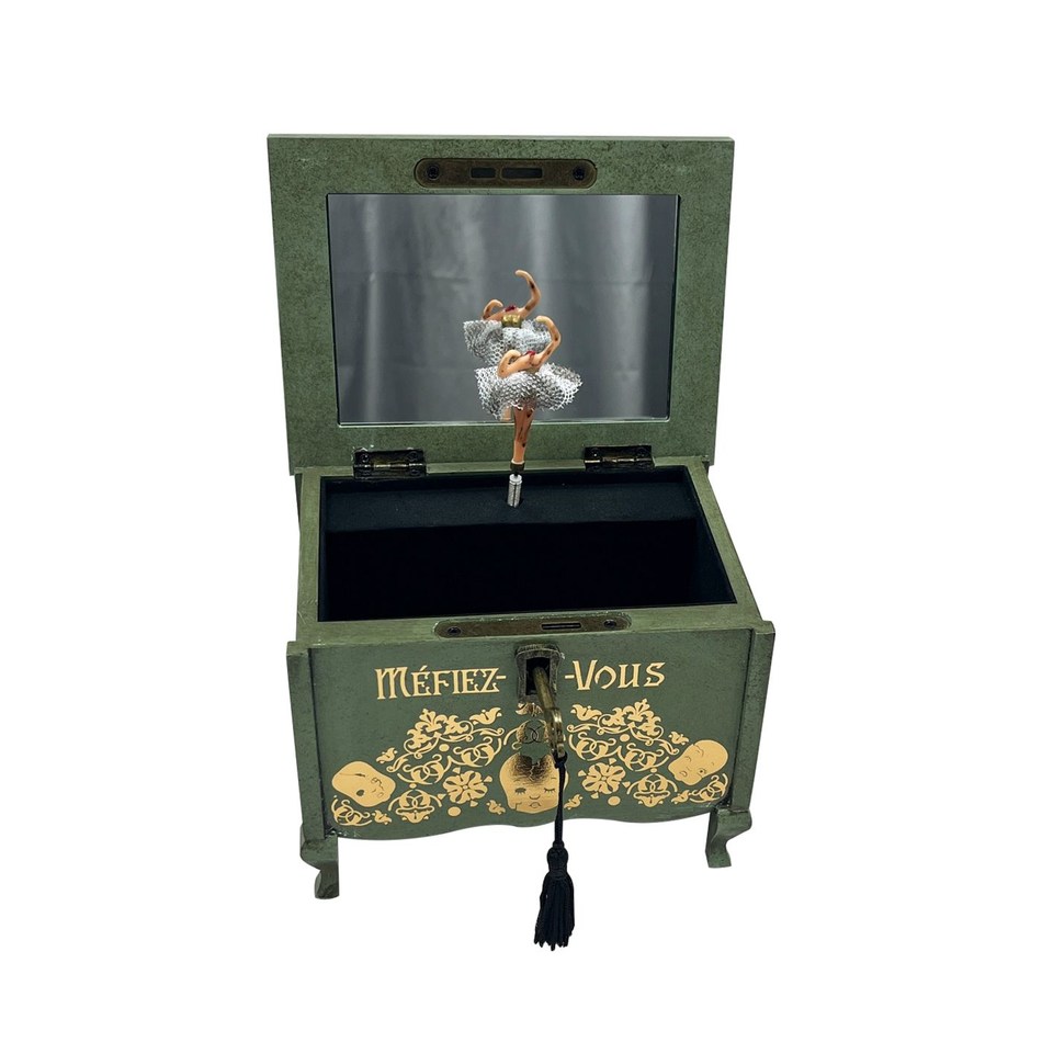 Green haunted music box with an open lid and a ballerina inside